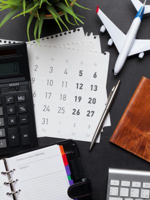 Business trip concept. Accessories on desk table