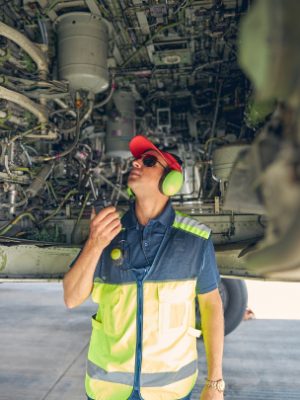 qualified-aviation-mechanic-inspecting-the-airplan-2023-11-27-05-37-11-utc